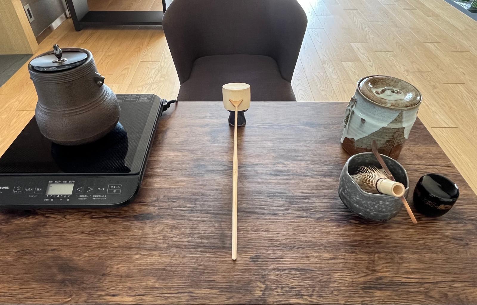 Tea utensils in Matsumoto's home, with a kettle on an induction stove to boil water